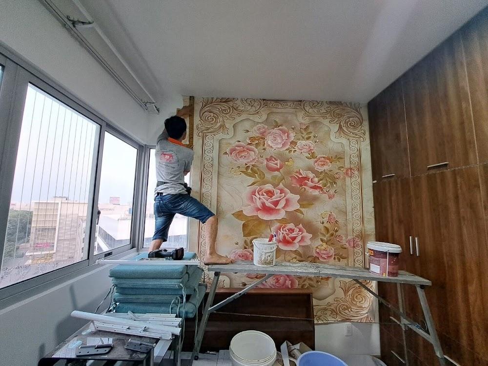 Kỹ thuật viên tiến hành Thi công tranh dán tường cho khách hàng tại đường Nguyễn Cư Trinh