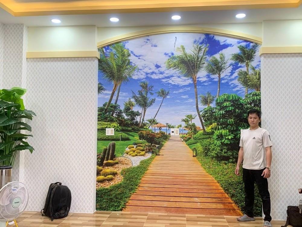 Bàn giao tranh dán tường 3D phong cảnh resort biển hàng dừa xanh lồng ô vòm điểm nhấn phòng khách